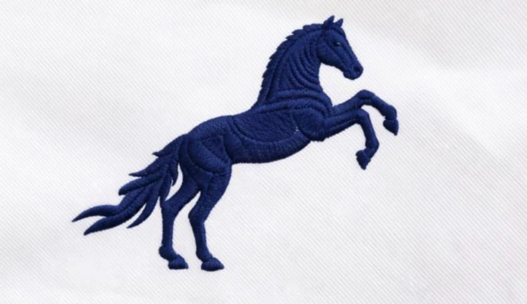 Navy embroidered rearing horse, the Pegaso mark
